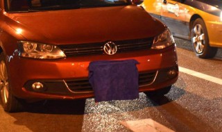 前面车牌用毛巾挡着会不会是违章 有谁知道吗